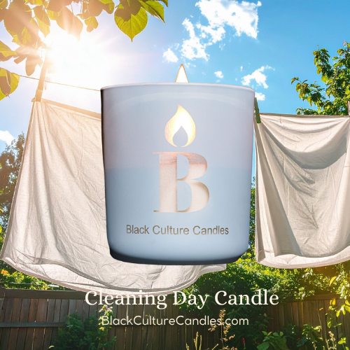 Black Culture Candles Cleaning Day 13oz matte light blue etched glass candle with white laundry on a clothesline against a bright blue sky