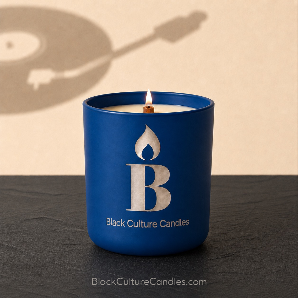Rhythm and Blues Candle by Black Culture Candles. Matte navy etched glass jar on black slate with shadowed beige background.