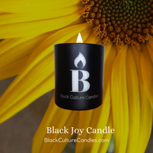 Load image into Gallery viewer, Black Joy luxury scented candle in etched glass with notes of citrus, pineapple, and amber—handcrafted with non-toxic wax and a crackling wood wick. A vibrant scent inspired by Black cultural joy, sunshine, and connection.
