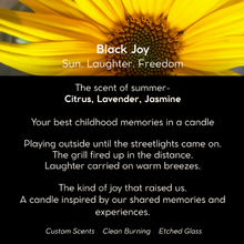 Load image into Gallery viewer, Black Joy luxury scented candle in etched glass with notes of citrus, pineapple, and amber—handcrafted with non-toxic wax and a crackling wood wick. A vibrant scent inspired by Black cultural joy, sunshine, and connection.


