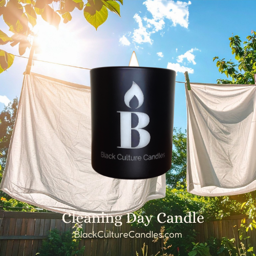 Black Culture Candles Cleaning Day 8oz matte black etched glass candle with white laundry on a clothesline against a bright blue sky