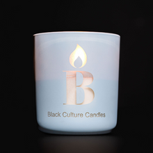 Load image into Gallery viewer, Transform your space with our Cleaning Day Candle. With notes of melon, eucalyptus and cucumber, it’s the essence of a clean smelling home. Crafted with premium non-toxic ingredients, this candle invites you on a memorable scent journey. Shop now to celebrate joy, culture, and connection through the art of scent. BlackCultureCandles.com
