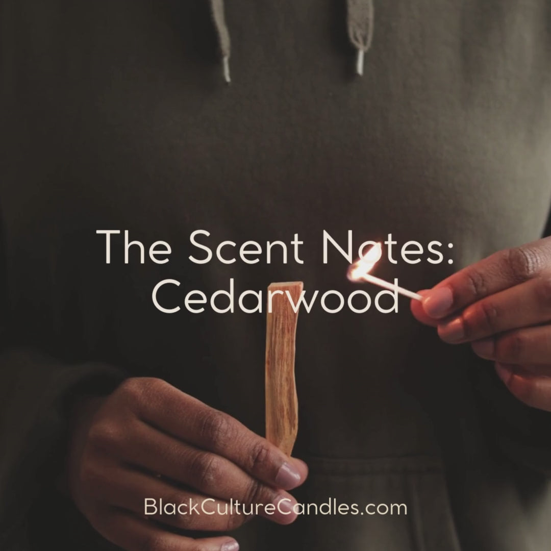 Silent Night Candle by Black Culture Candles® — a luxury artisan Christmas candle in etched matte black glass with a delicate nativity design. Handcrafted with a shimmering vegan coconut-apricot wax blend and a sustainably sourced crackling wood wick, this reflective holiday scent features saffron, cedar, vetiver, amber, tobacco, and myrrh for a warm, timeless fragrance that captures the calm and stillness of Christmas Eve.