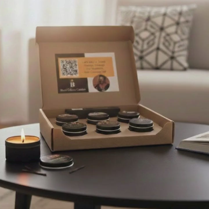 Scent Journey Sampler set of six 2oz candles in matte black tins, hand-poured with vegan coconut apricot wax and crackling wood wicks. Includes Grandma’s Garden, Black Joy, Black Love, Friday Night, Cleaning Day, and Rhythm & Blues—crafted for joy, culture, and connection. Guided scent journey video included.
