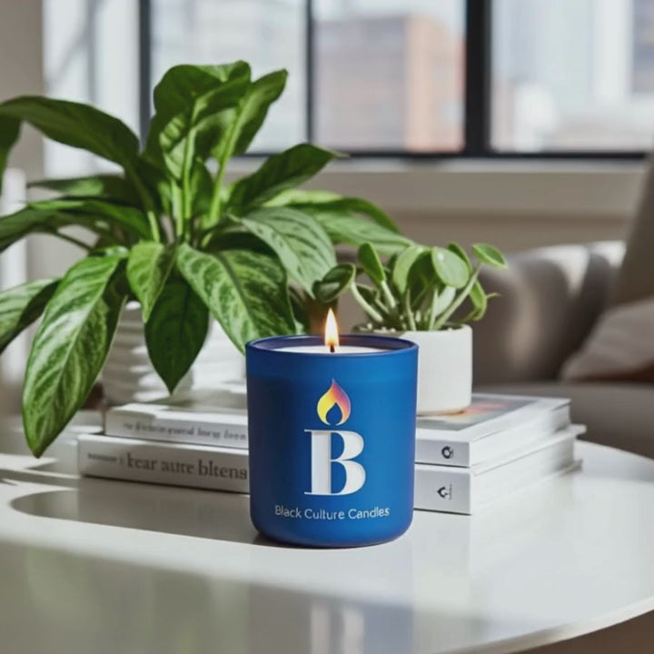 Rhythm and Blues candle by Black Culture Candles burning in an etched glass vessel with a crackling wood wick.