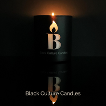 Load image into Gallery viewer, Black Love luxury candle in matte black etched glass with scent notes of orchid, sandalwood, and amber—handcrafted with non-toxic wax and a crackling wood wick. A grounding scent that honors care, connection, and culture.

